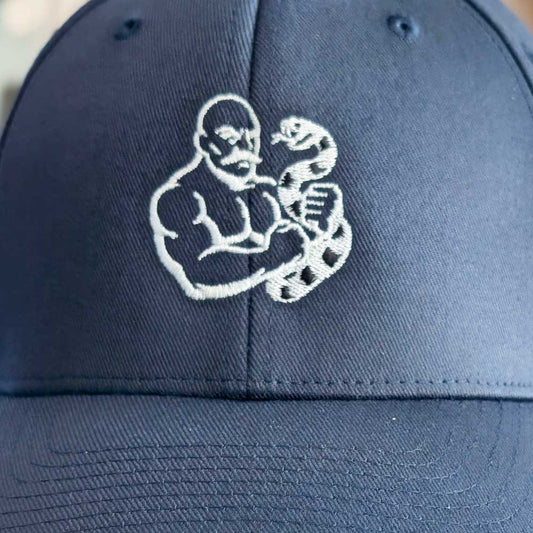 Queer Strength Baseball Hat – Fitted Curved-Brim Cap with Mustached Bodybuilder and Snake Embroidery