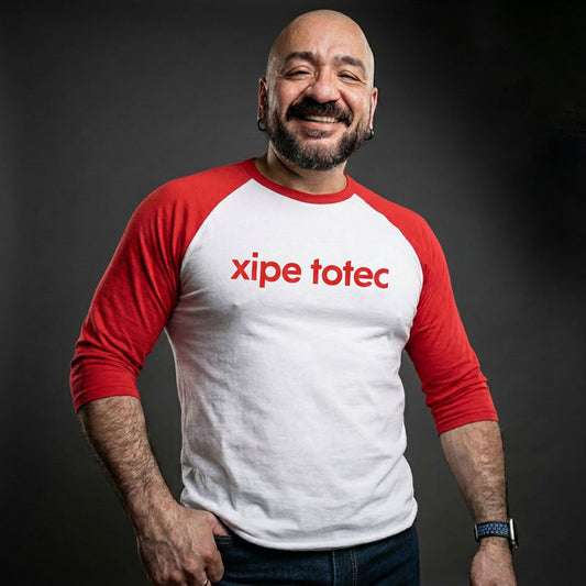 Xipe Totec 3/4 baseball tee: white body, red raglan sleeves, name printed in red across the chest.