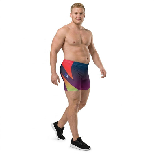 Muscular plus-size model wearing LED Queens Hypertrophy Spandex Shorts with bold geometric chevrons in red, orange, yellow-green, and lime on a navy-to-purple gradient base