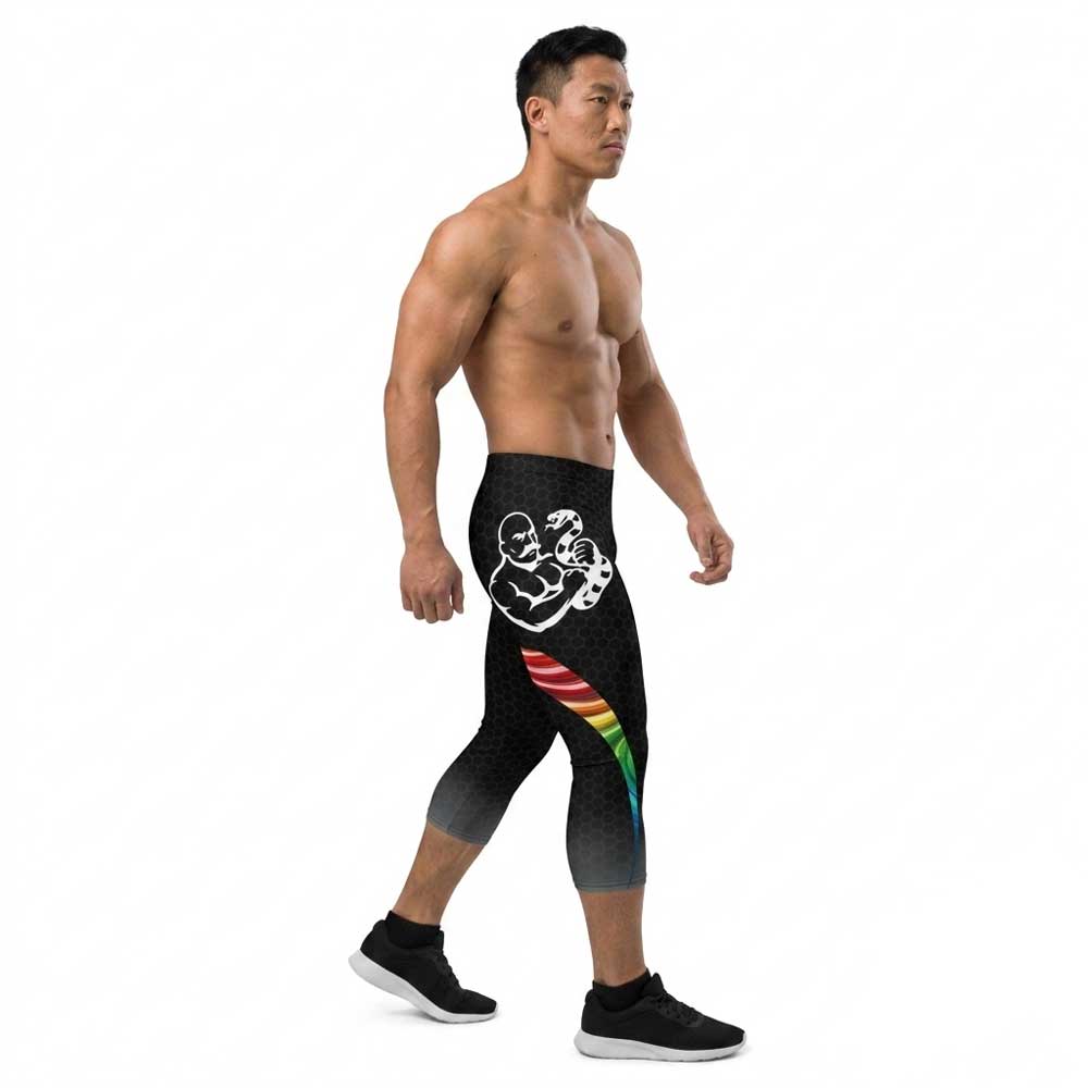 Queer Strength Capri Bodybuilding Tights by LED Queens—black honeycomb spandex with rainbow side panels and original Queer Strength mark. Unity '26 Pride Collection 2026.