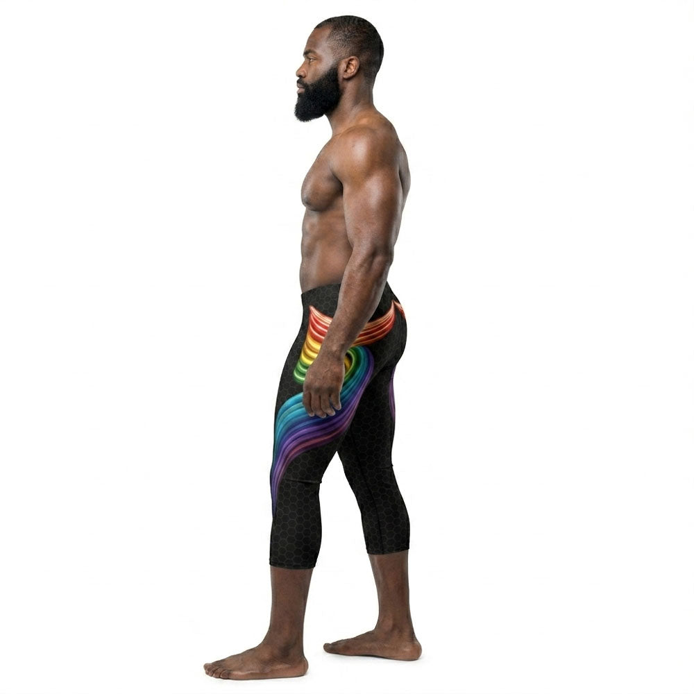 Man wearing black leggings with rainbow design on a white background