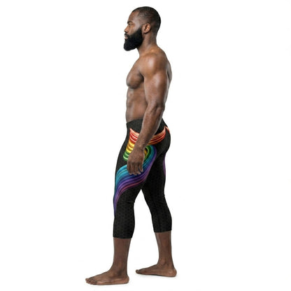 Man wearing black leggings with rainbow design on a white background