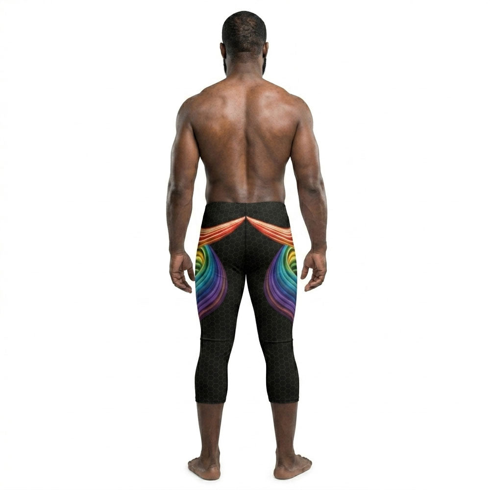 Person wearing black capri leggings with colorful abstract design on a white background