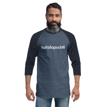 Huitzilopochtli 3/4 baseball tee: blue body, navy blue raglan sleeves, name printed in white across the chest.